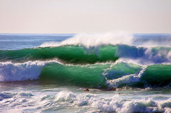 Backlit ocean waves